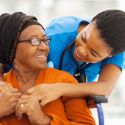 caregiver-talking-with-elder-woman-wheelchair caregiver-talking-with-elder-woman-wheelchair